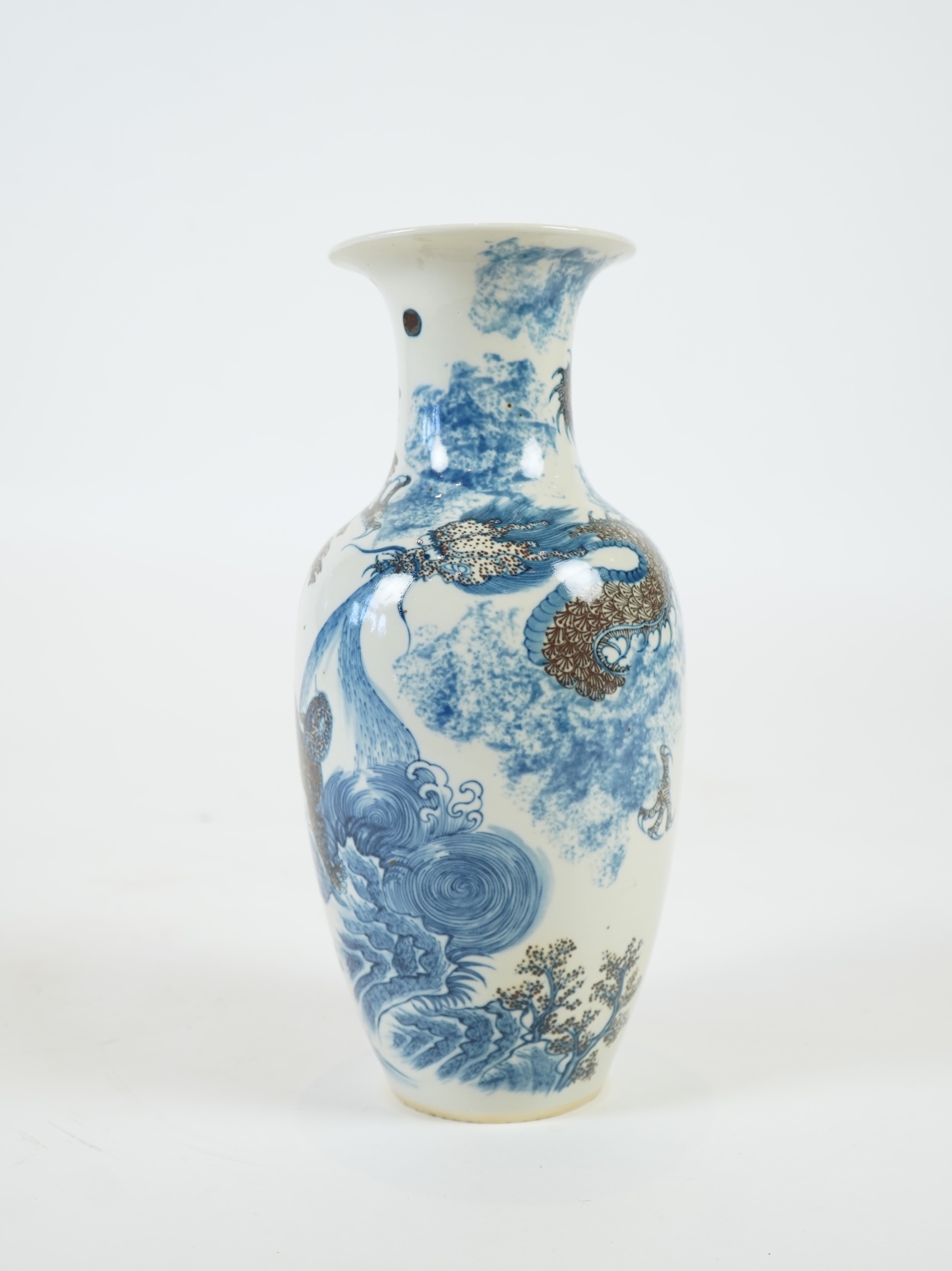 A Chinese underglaze blue and copper red ’dragon and tiger’ baluster vase, possibly 19th century